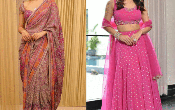 Two women showcasing elegant party wear styles by Loyal Creations—one wearing a designer saree with a statement embroidered blouse, and the other in a pink lehenga set with a handcrafted blouse—highlighting different party wear dress styles for ladies.